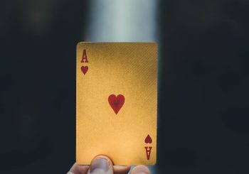 person holding ace of heart playing card - Gifts for Card Players