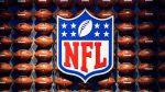 The NFL logo placed against a wall of footballs - fantasy NFL football