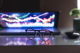 Photo of a laptop with electronic light pattern on the screen and eyeglasses in the foreground to illustrate an article titled 5-Affordable Casino Platforms for Entrepreneurs