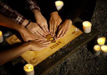 The Ouija Board with people playing it