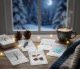 WIntry Tarot Cards spread on a table in front of a window with a snowy back yard and half moon.