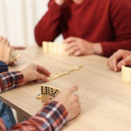 Friends playing dominoes