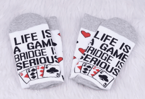 Socks with the words - Life is a Game Bridge is Serious